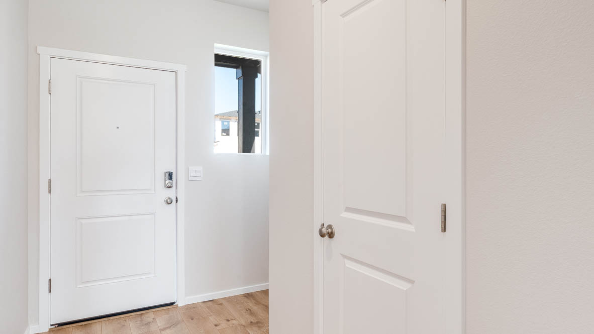 Terrace at Pleasant Valley entry with front window and the powder room door