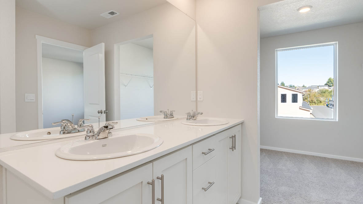 Terrace at Pleasant Valley bathroom with solid surface countertops, toilet, and walk in closet