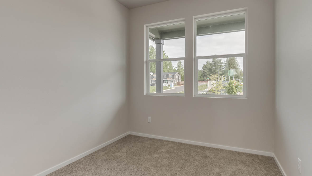 Terrace at Pleasant Valley bedroom with two windows and white walls and light carpeting