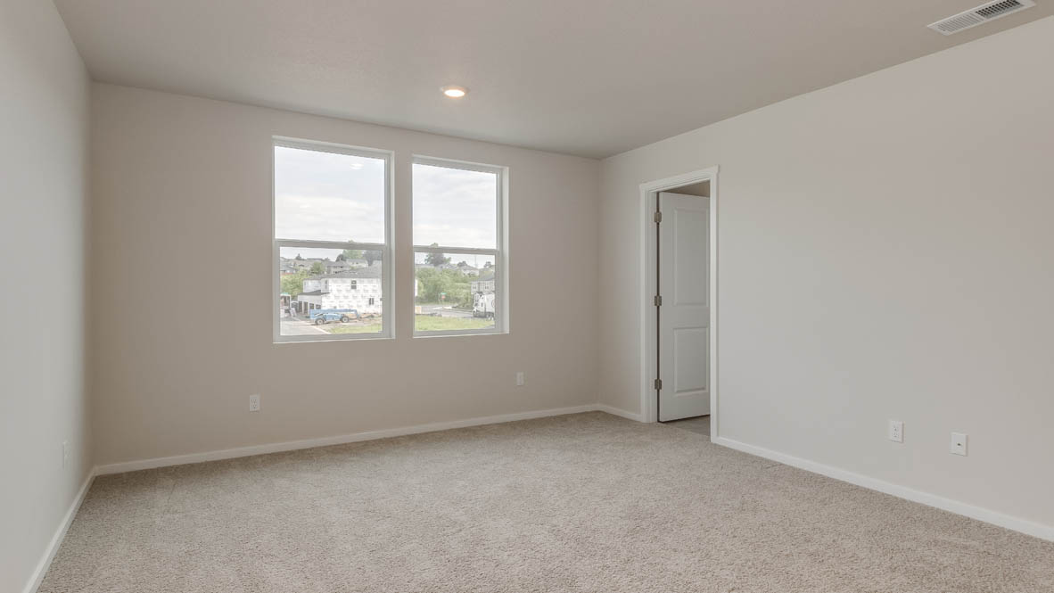 Terrace at Pleasant Valley primary bedroom with carpeting and windows and en suite bathroom