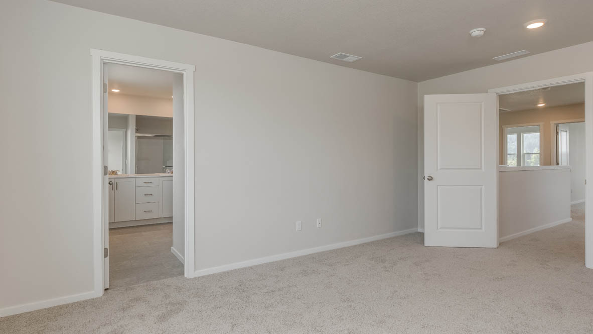 Terrace at Pleasant Valley primary bedroom with carpeting and windows and en suite bathroom