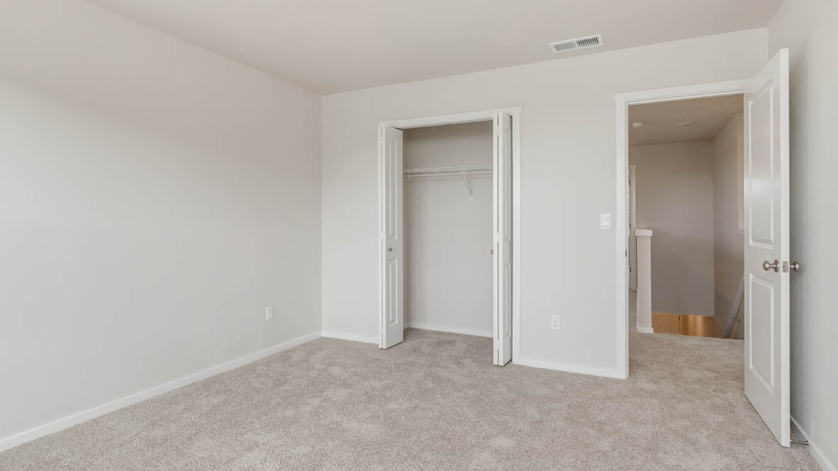 Terrace at Pleasant Valley bedroom with carpeting and closet with white wire shelving