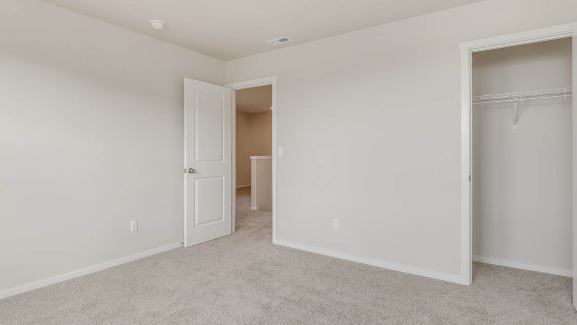 Terrace at Pleasant Valley bedroom with carpeting and closet with white wire shelving