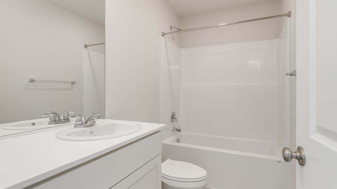 Terrace at Pleasant Valley secondary bathroom with tub shower and single sink vanity