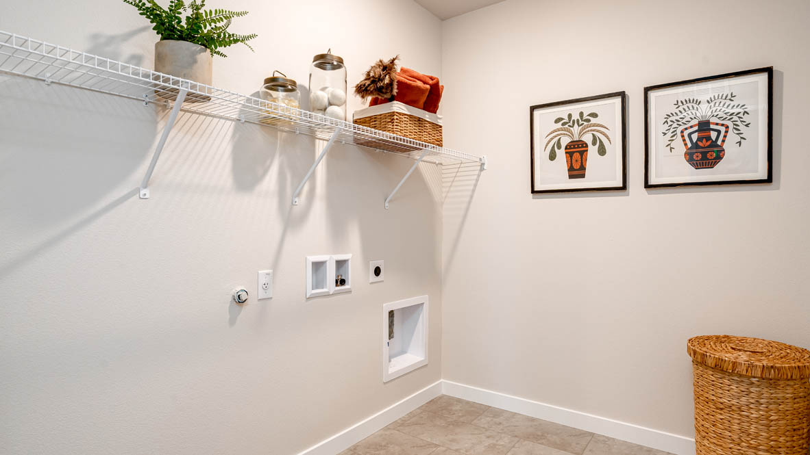 Butler Creek Crossing laundry room with white wire shelving
