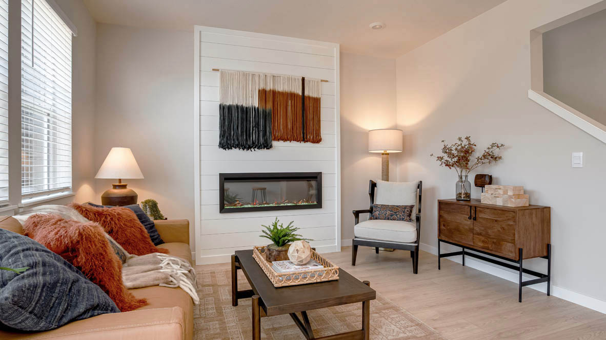 Butler Creek Crossing great room with electric fireplace and floor to ceiling shiplap wall