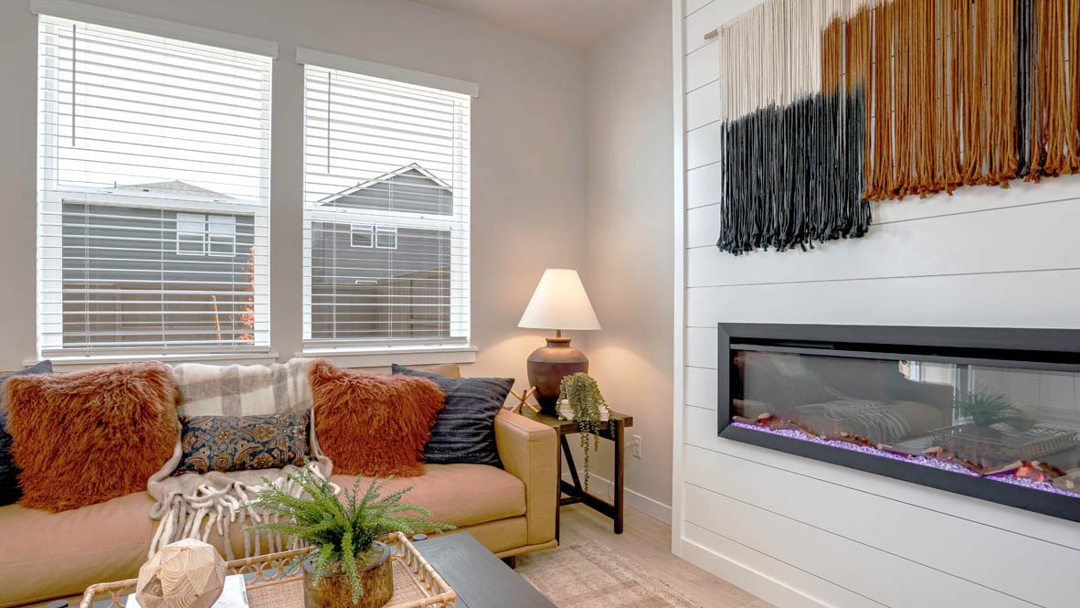 Butler Creek Crossing great room with electric fireplace and floor to ceiling shiplap wall
