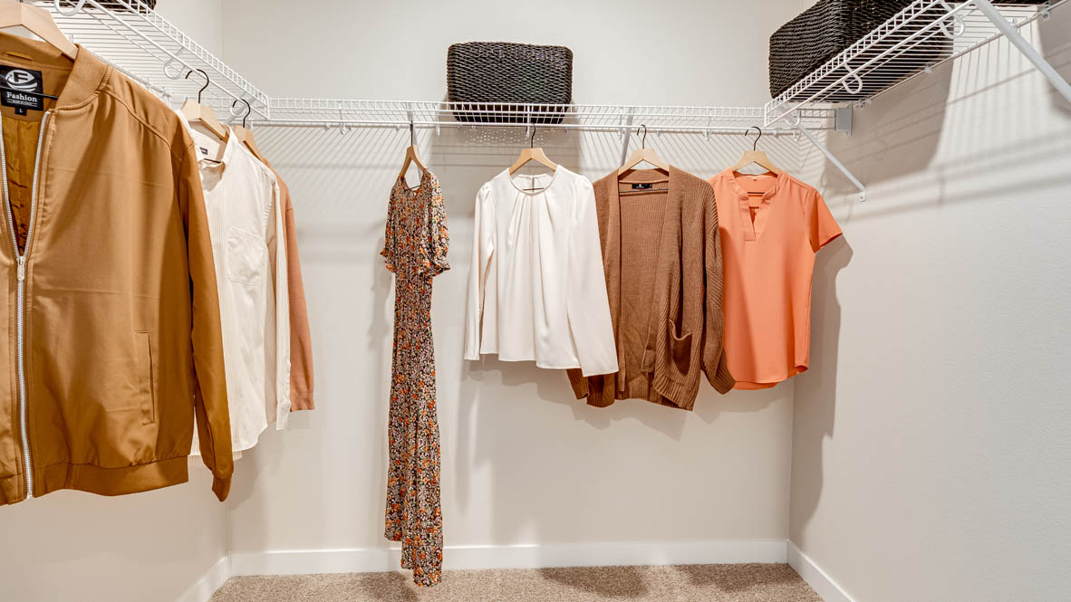 Butler Creek Crossing walk-in closet with white wire hangers