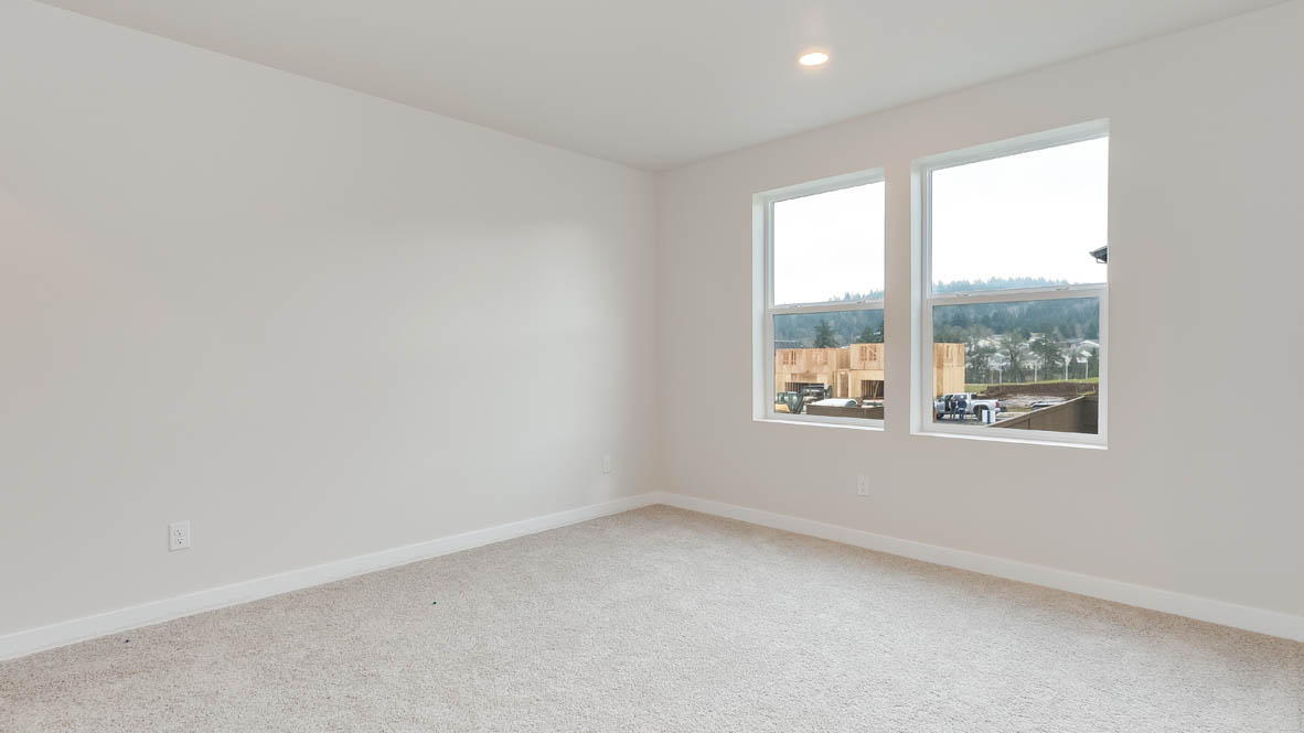 Butler Creek Crossing primary bedroom with carpet, windows