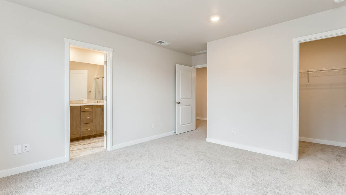 Butler Creek Crossing primary bedroom with carpet, a closet