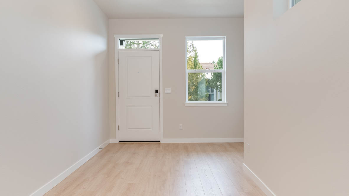 Butler Creek Crossing Entry with laminate flooring and window