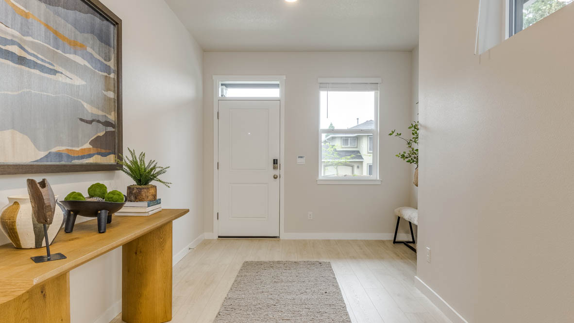 Butler Creek Crossing Entry with laminate flooring and window