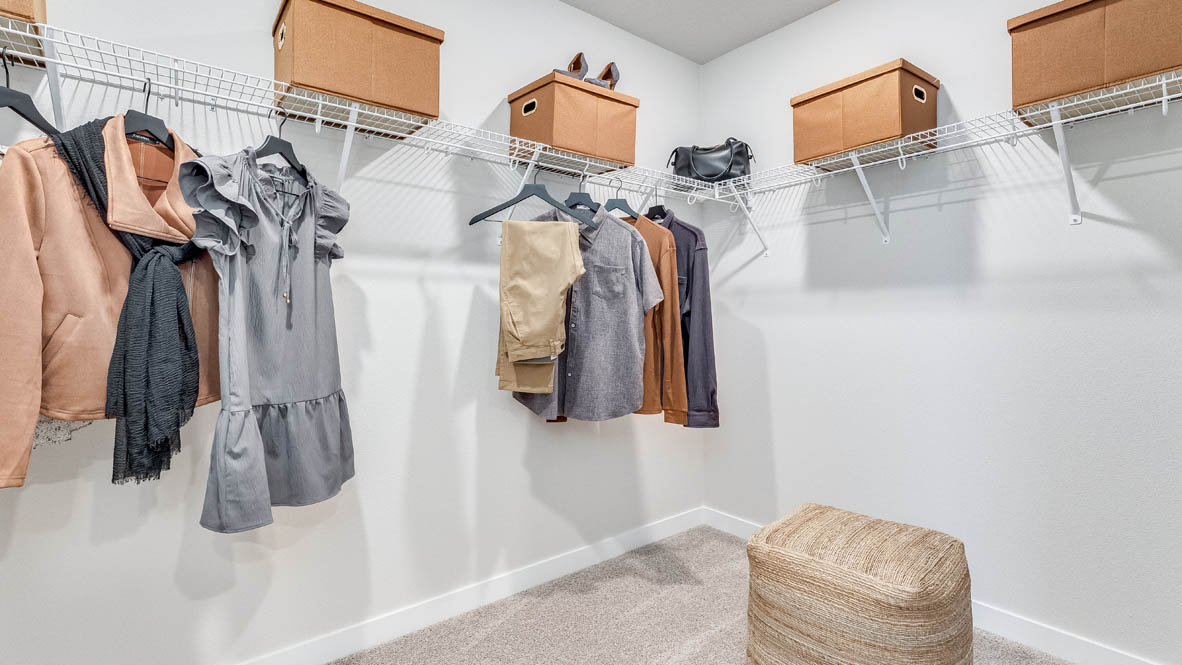 Butler Creek Crossing walk-in closet with white wire hangers