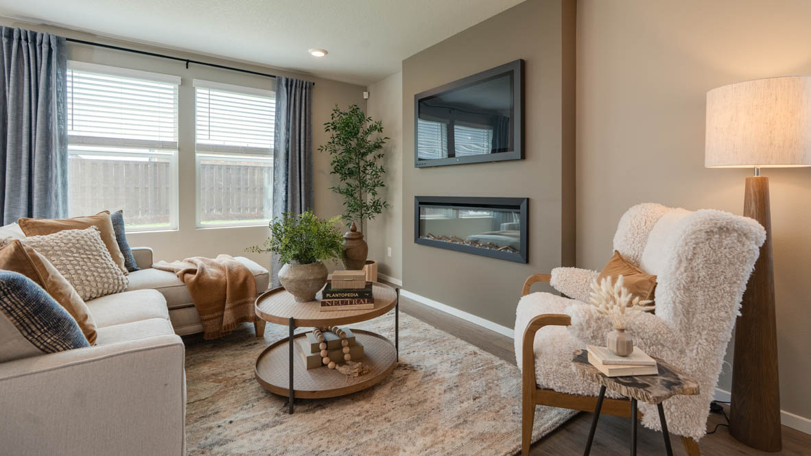 Bailey Meadows great room with electric fireplace and floor to ceiling painted accent wall