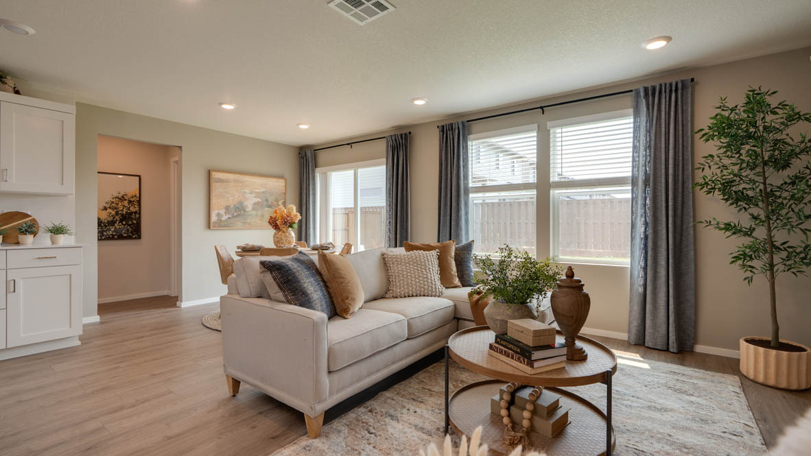 Bailey Meadows great room with electric fireplace and floor to ceiling painted accent wall