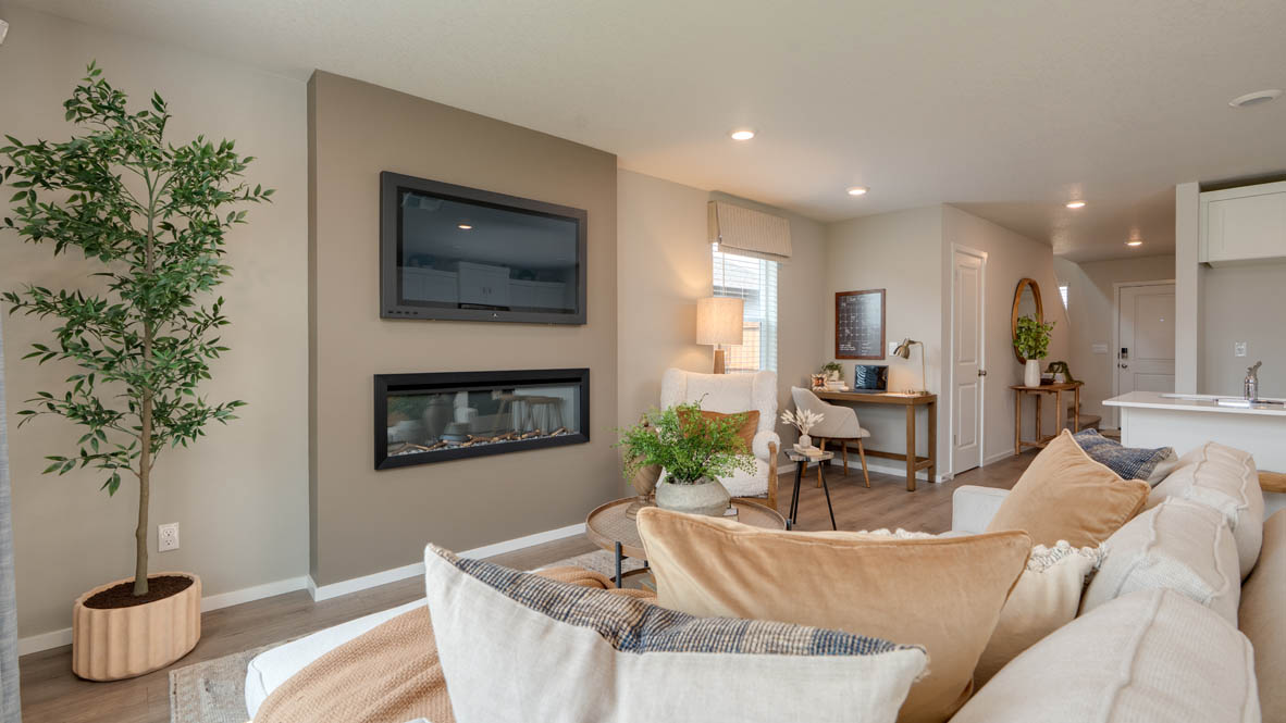 Bailey Meadows great room with electric fireplace and floor to ceiling painted accent wall