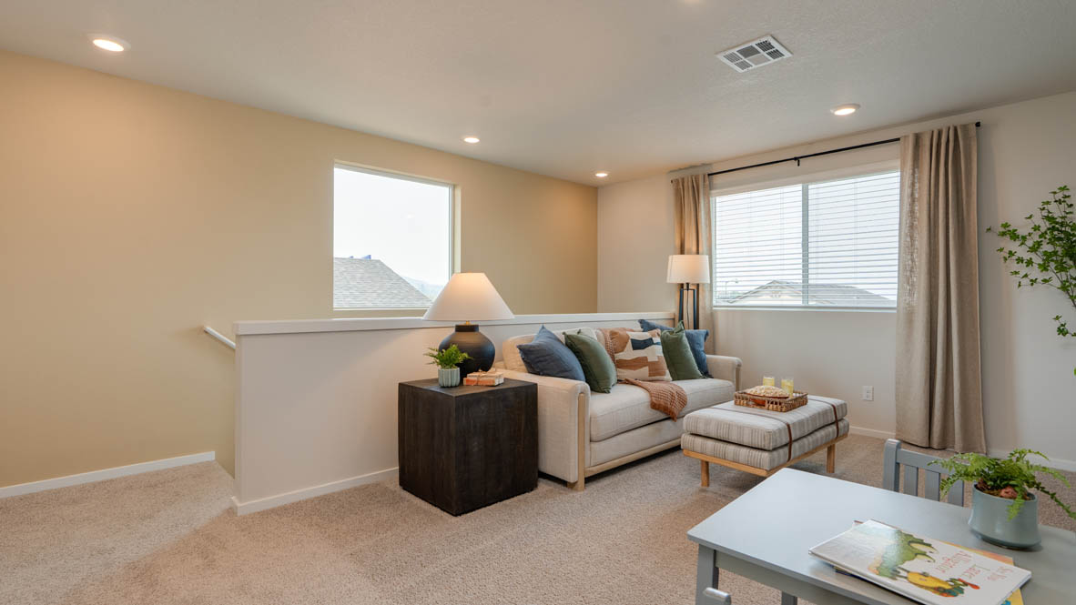 Bailey Meadows upstairs loft set up with television and couches