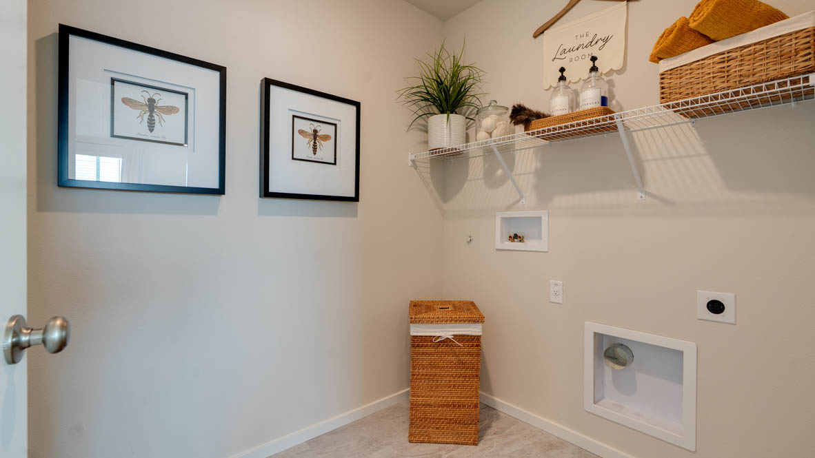 Bailey Meadows laundry room with white wire shelving