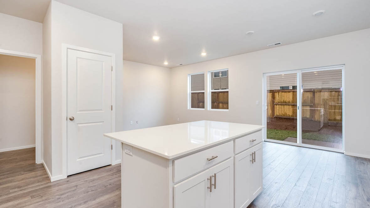East Park Village kitchen with white shaker style cabinets and white quartz countertops