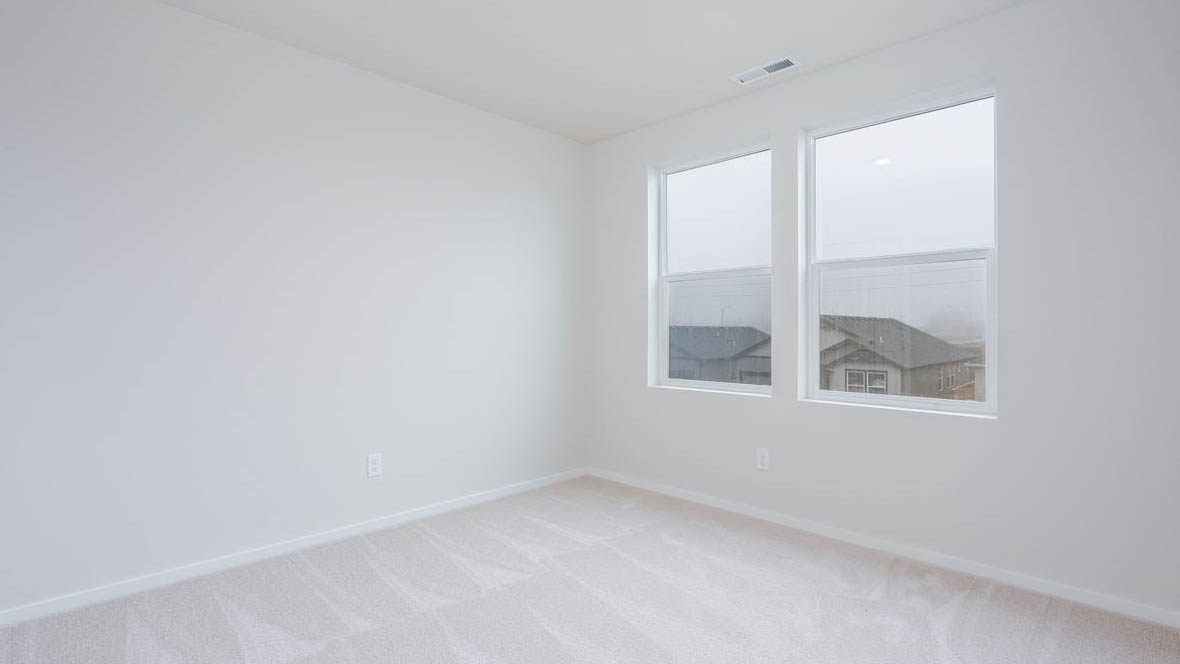 East Park Village bedroom with white carpeting, white walls, and white closet doors