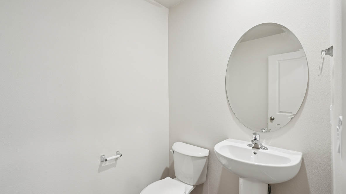 East Park Village powder room with pedestal sink and toilet