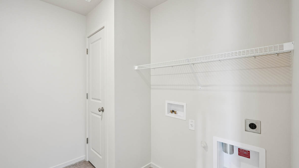 East Park Village laundry room with white wire shelving