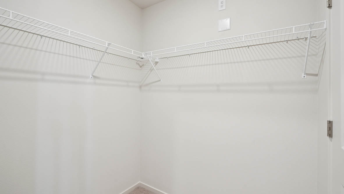 East Park Village Walk in Closet with white wire shelving