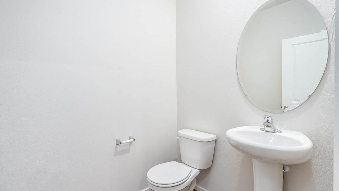 East Park Village powder room with pedestal sink and toilet