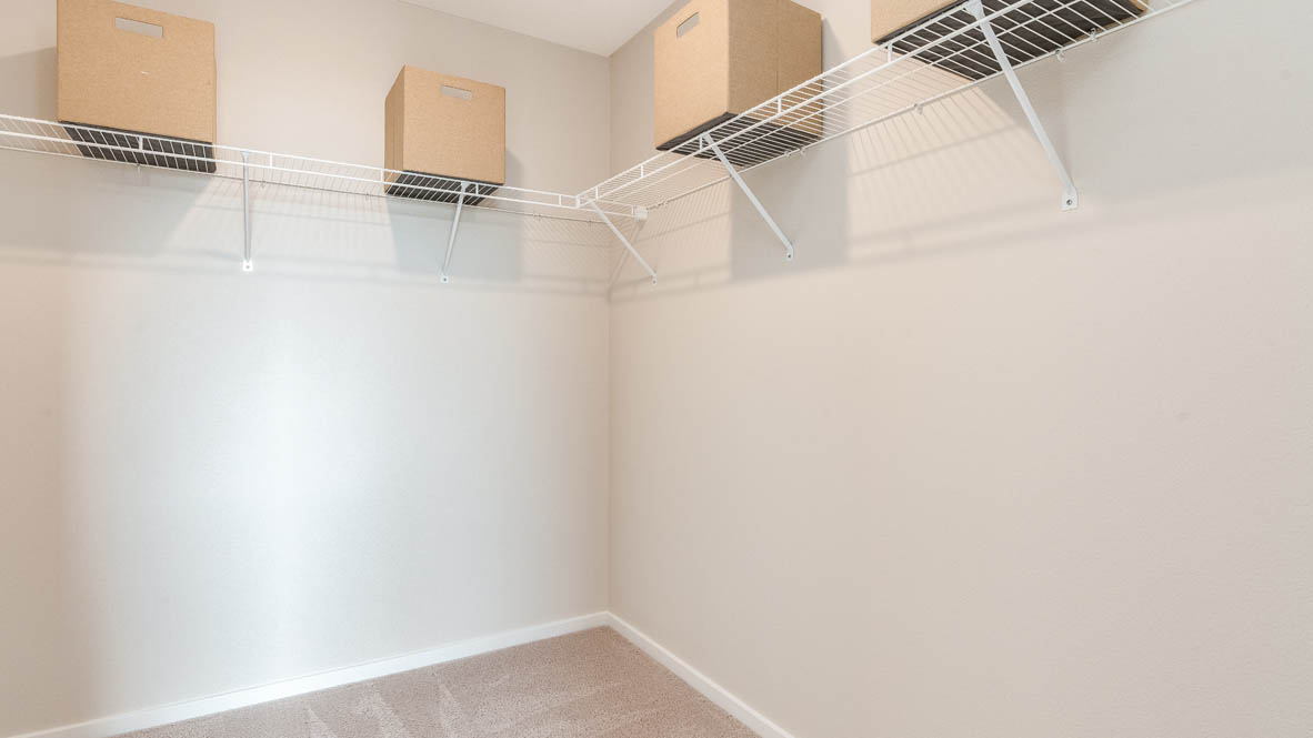 East Park Village walk in closet with white walls and white wire shelving