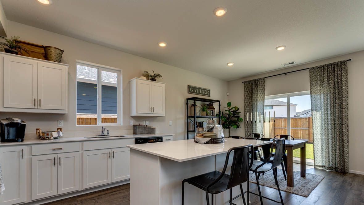 East Park Village kitchen with white cabinets and laminate flooring