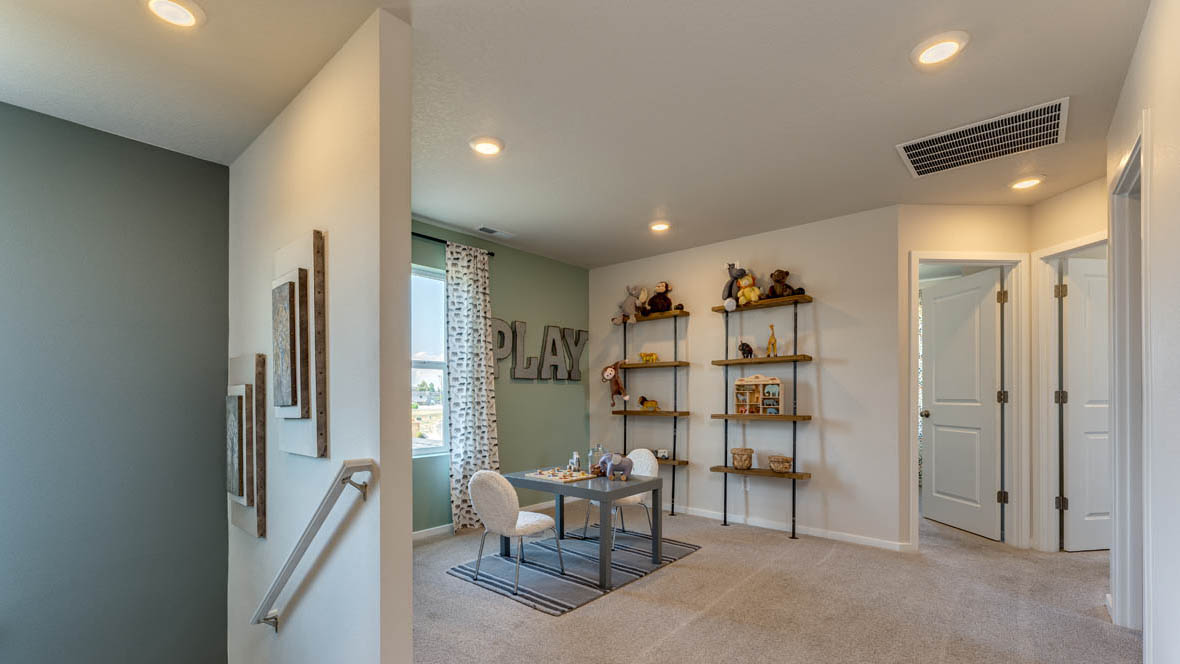 East Park Village loft with carpet, accent wall, and window