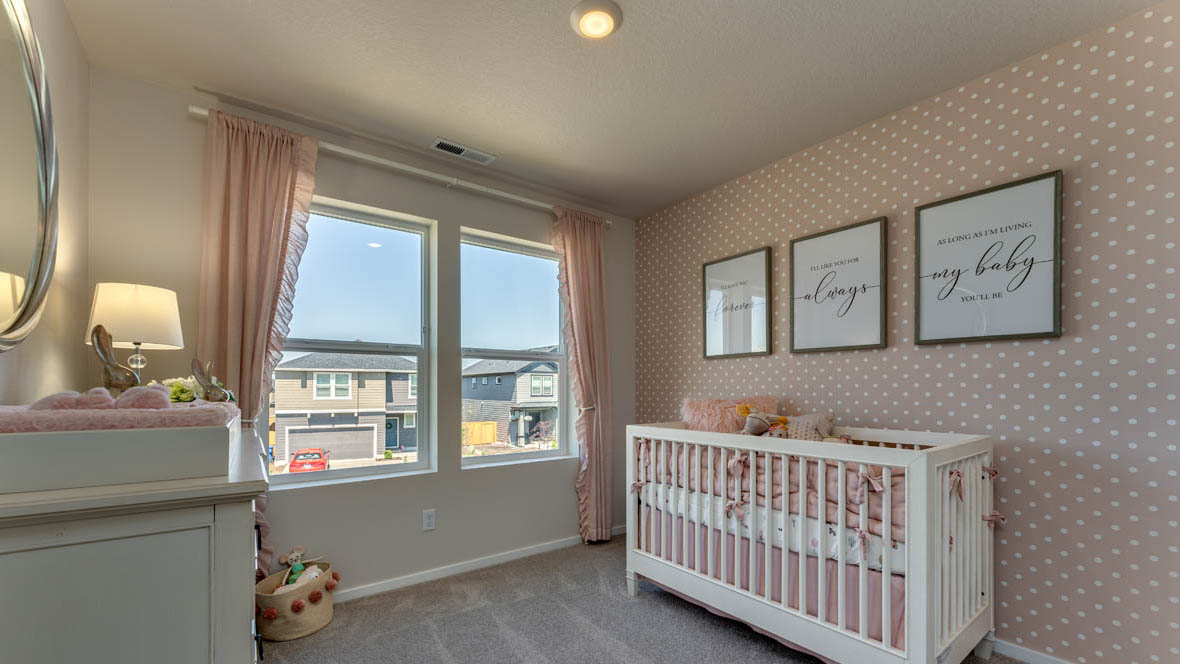 East Park Village bedroom with carpet, window, accent wall, and white furniture