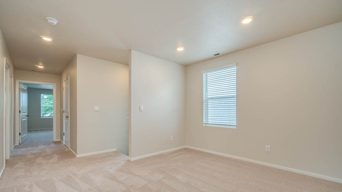 East Park loft with carpet, and white walls
