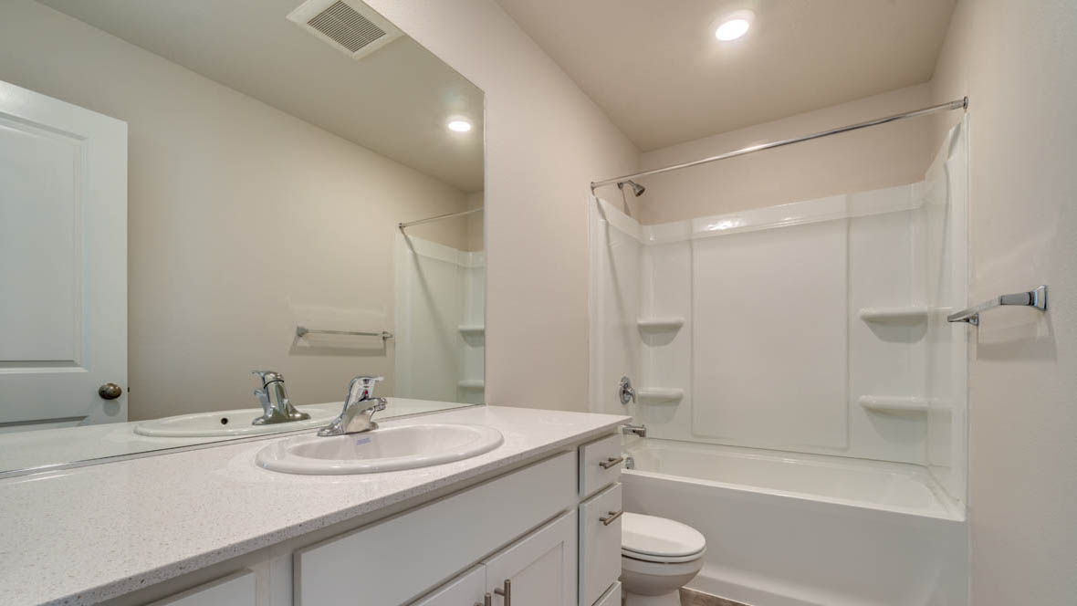 East Park bathroom with vanity, sink, mirror, toilet and tub shower