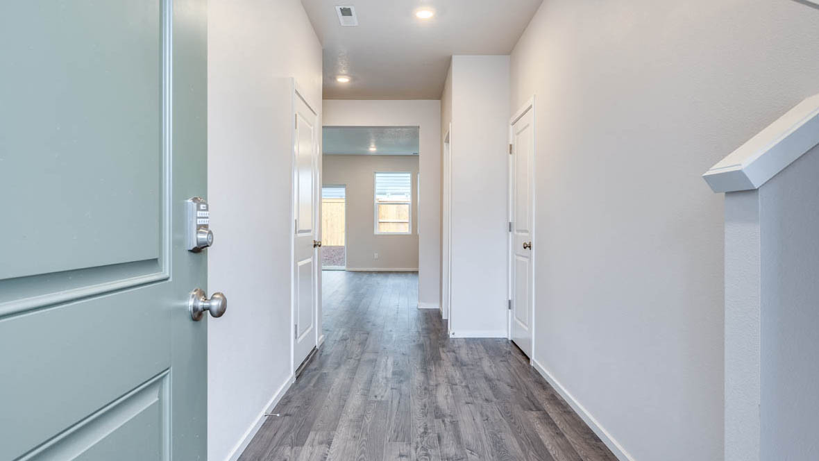 East Park Village Entry with laminate flooring and white walls