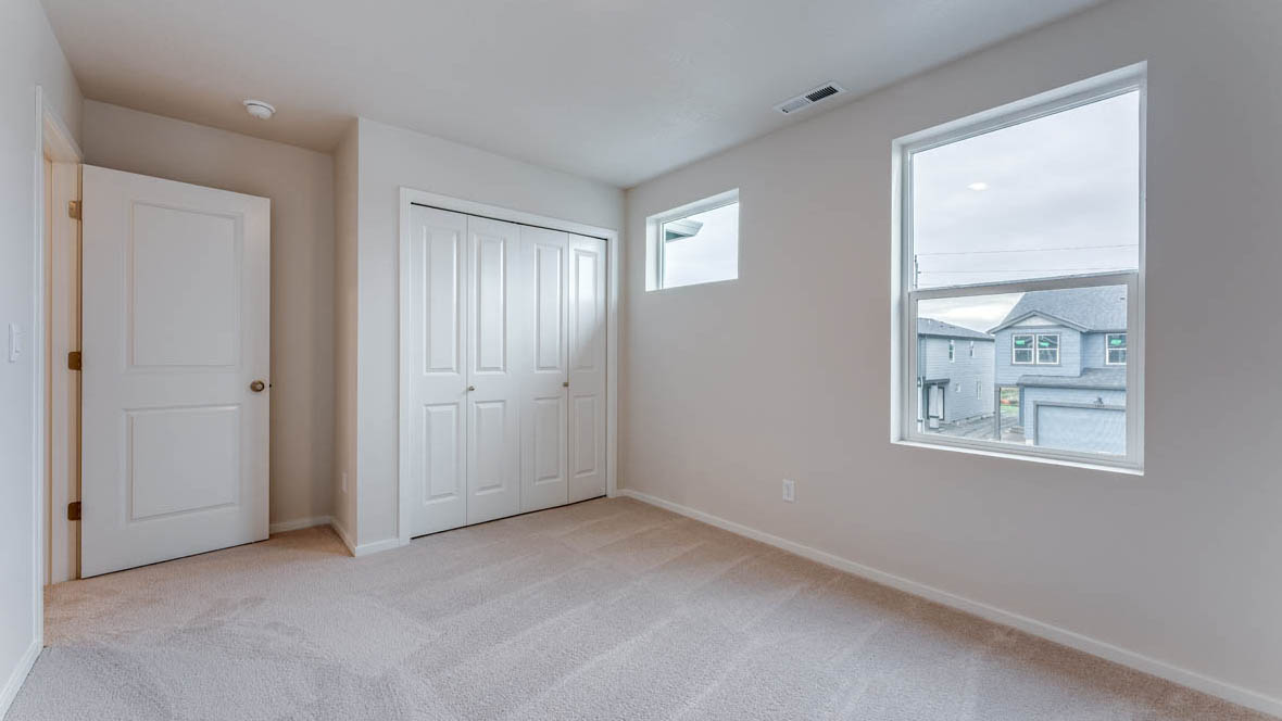 East Park Village Bedroom with carpet, windows, closet