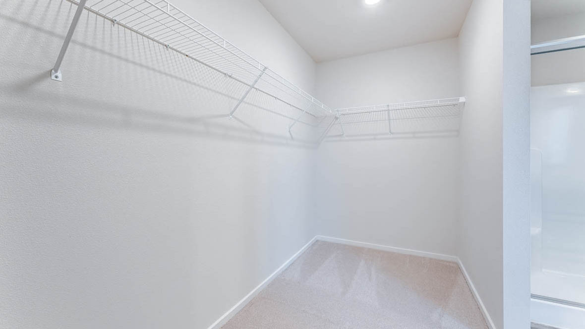 East Park Village walk in closet with white wire shelving