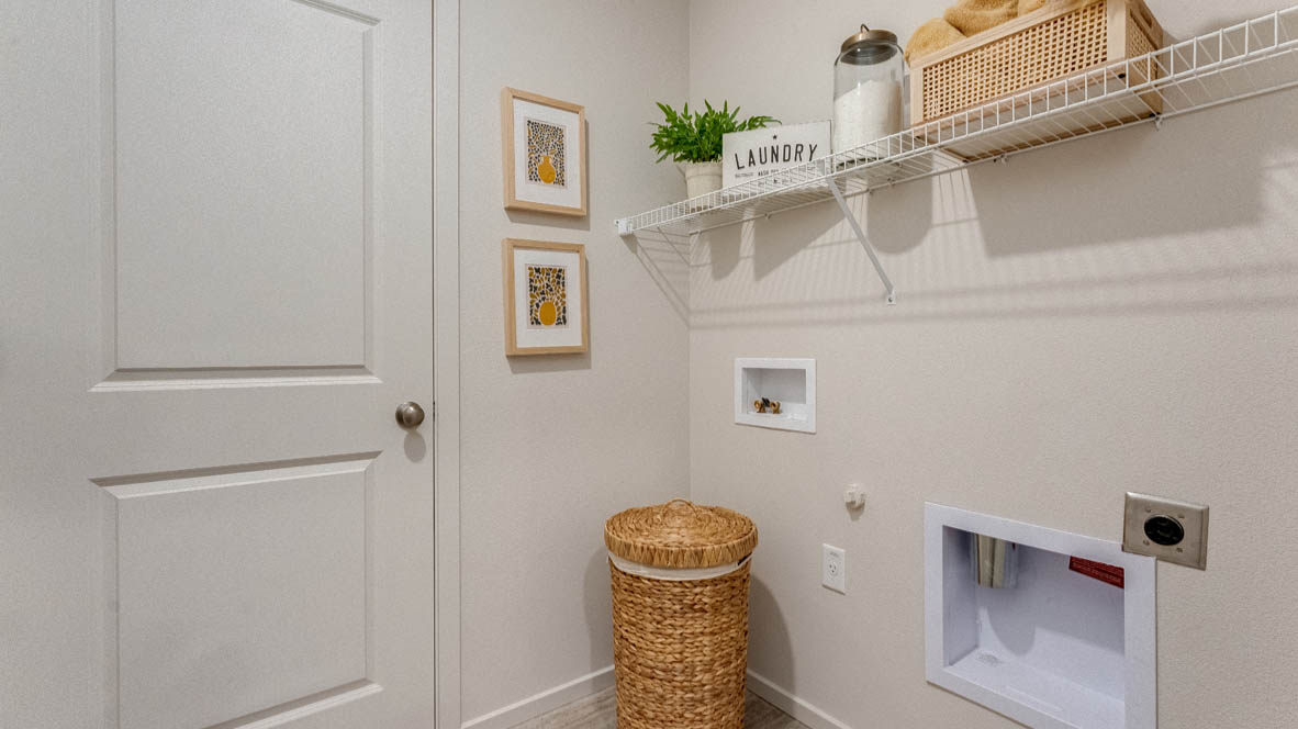 East Park Village laundry room with white wire shelving