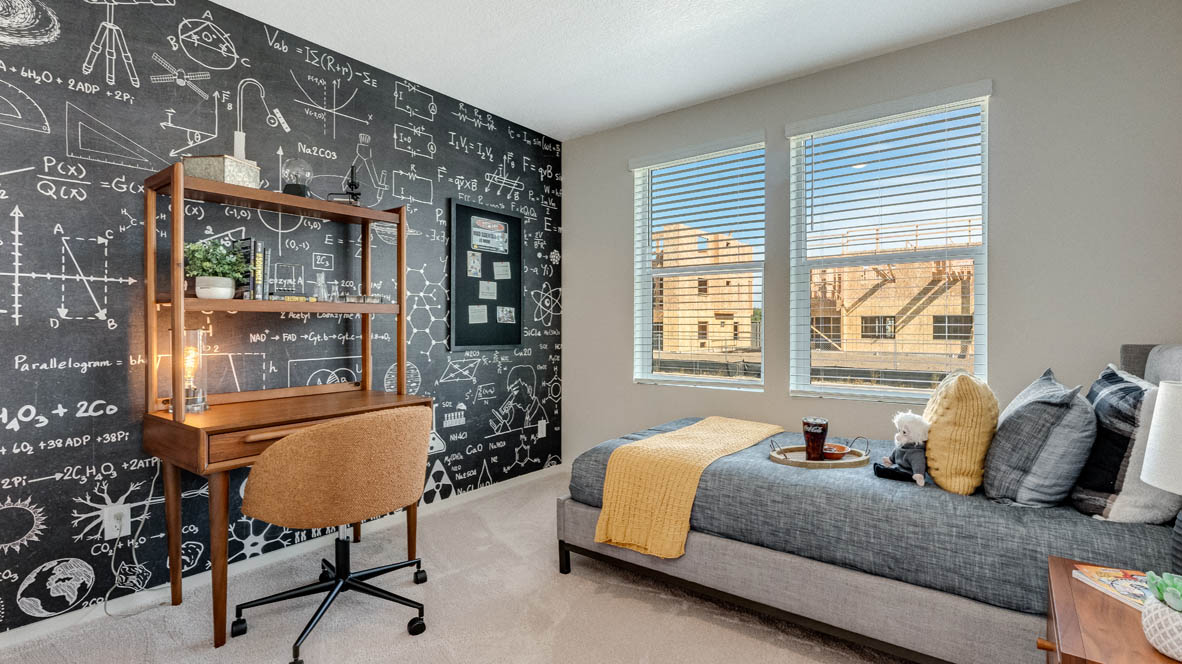East Park Village Bedroom with carpet, bed, bedding, accent wall, desk, chair, and painting, and windows