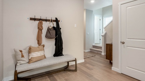 Misty Meadows entry with coat hooks and bench seat