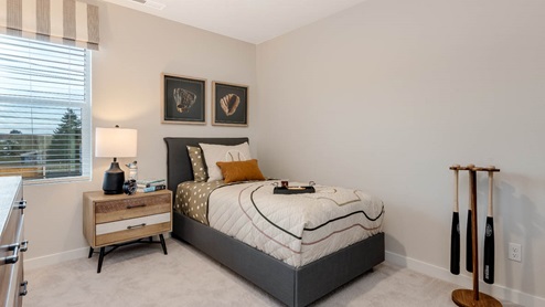 Misty Meadows bedroom with twin bed and baseball theme