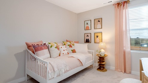 Misty Meadows bedroom with day bed and pink theme with pink drapes