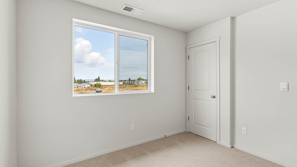 Addysen Park bedroom with carpet, window, and white walls