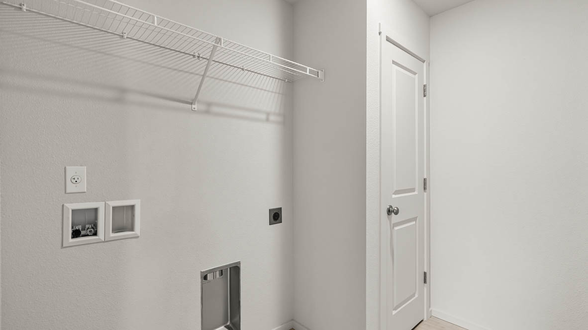 Addysen Park Laundry room with white walls and white wire shelving