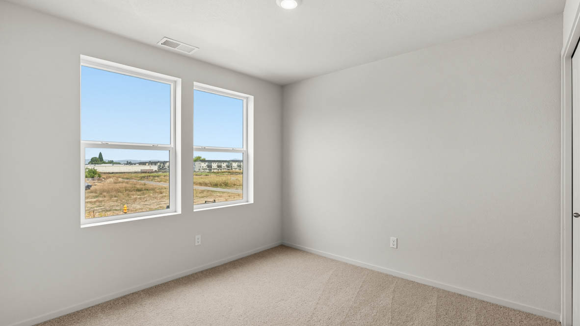 Addysen Park bedroom with carpet, window, and white walls