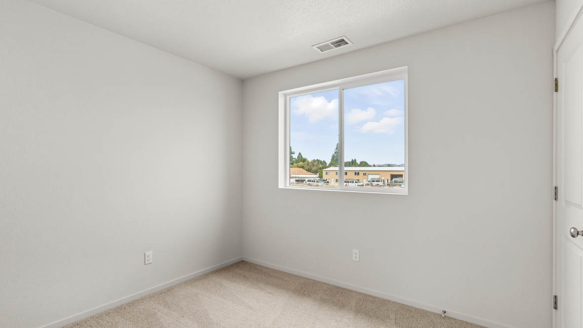 Addysen Park bedroom with carpet, window, and white walls