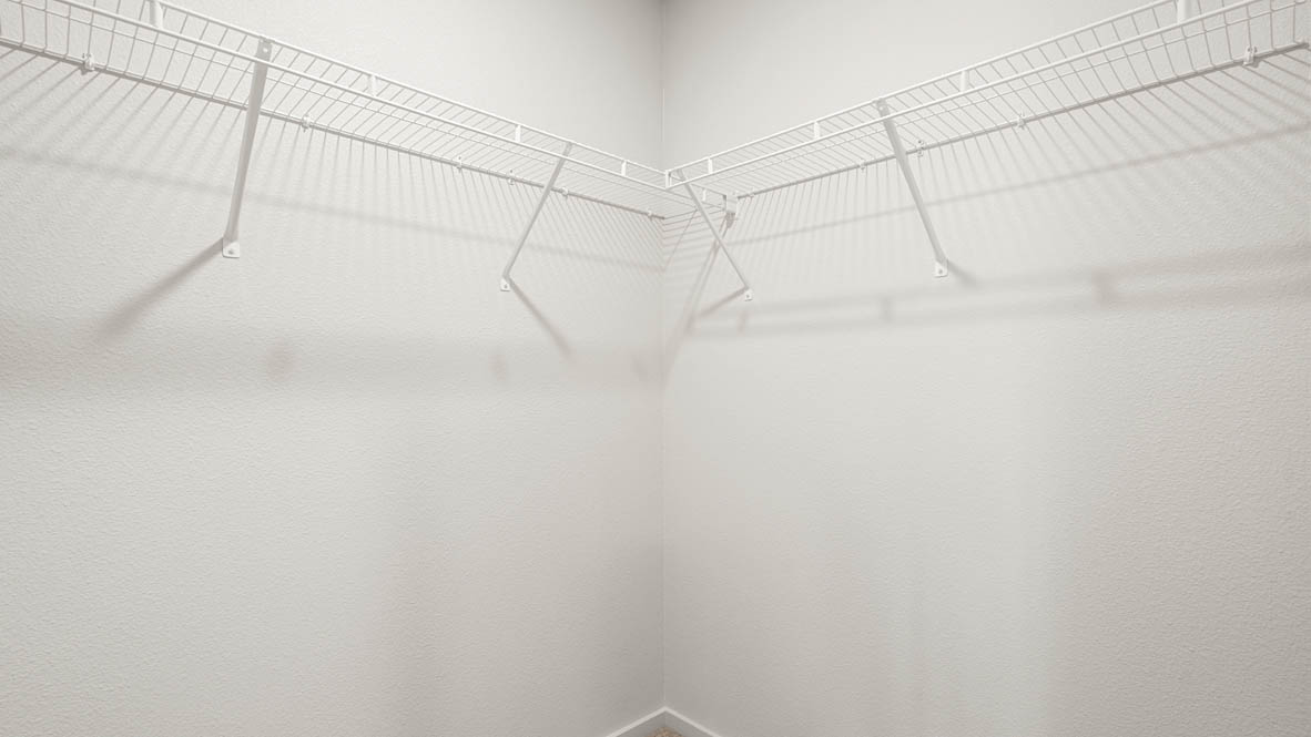 Addysen Park walk in closet with white wire shelving and white walls