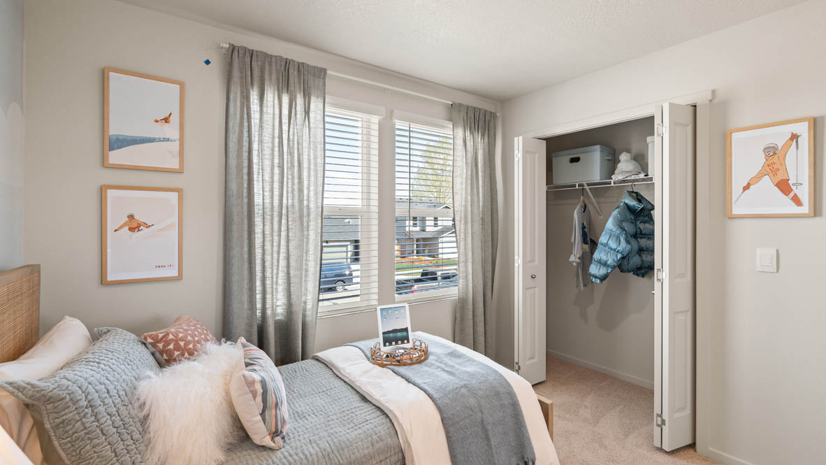 Addysen Park bedroom with twin bed and blue engineering theme and curtains and carpeting