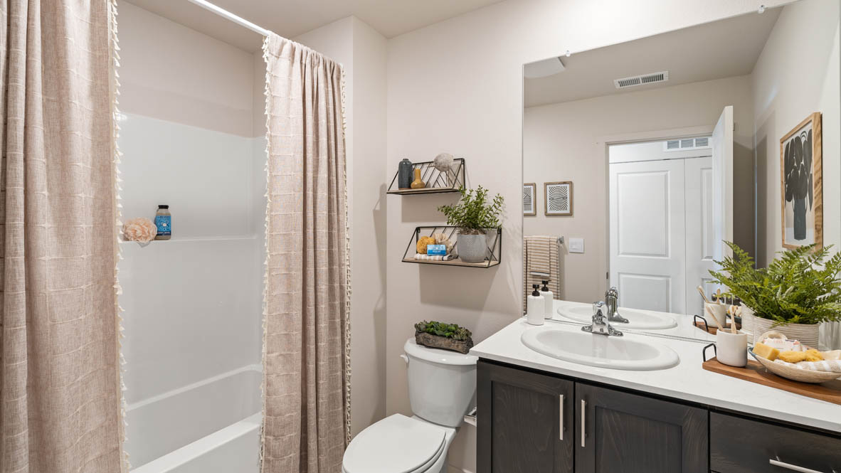 Addysen Park secondary bathroom with tub bath and single sink vanity with white quartz countertops