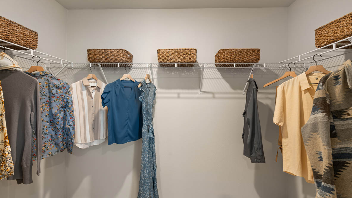 Addysen Park walk in closet with clothes and white wire shelving